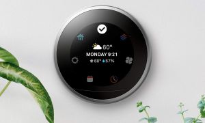 Nest Smart Thermostat on wall.