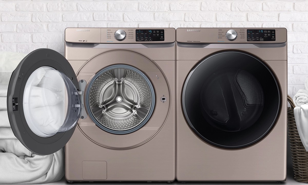 Samsung front-load washer and dryer set in chapagne finish in a laundry room.