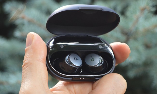 Soundcore Space A40 held in a hand.
