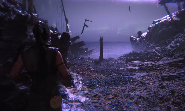 Senua approaching a lore totem in Hellblade 2.