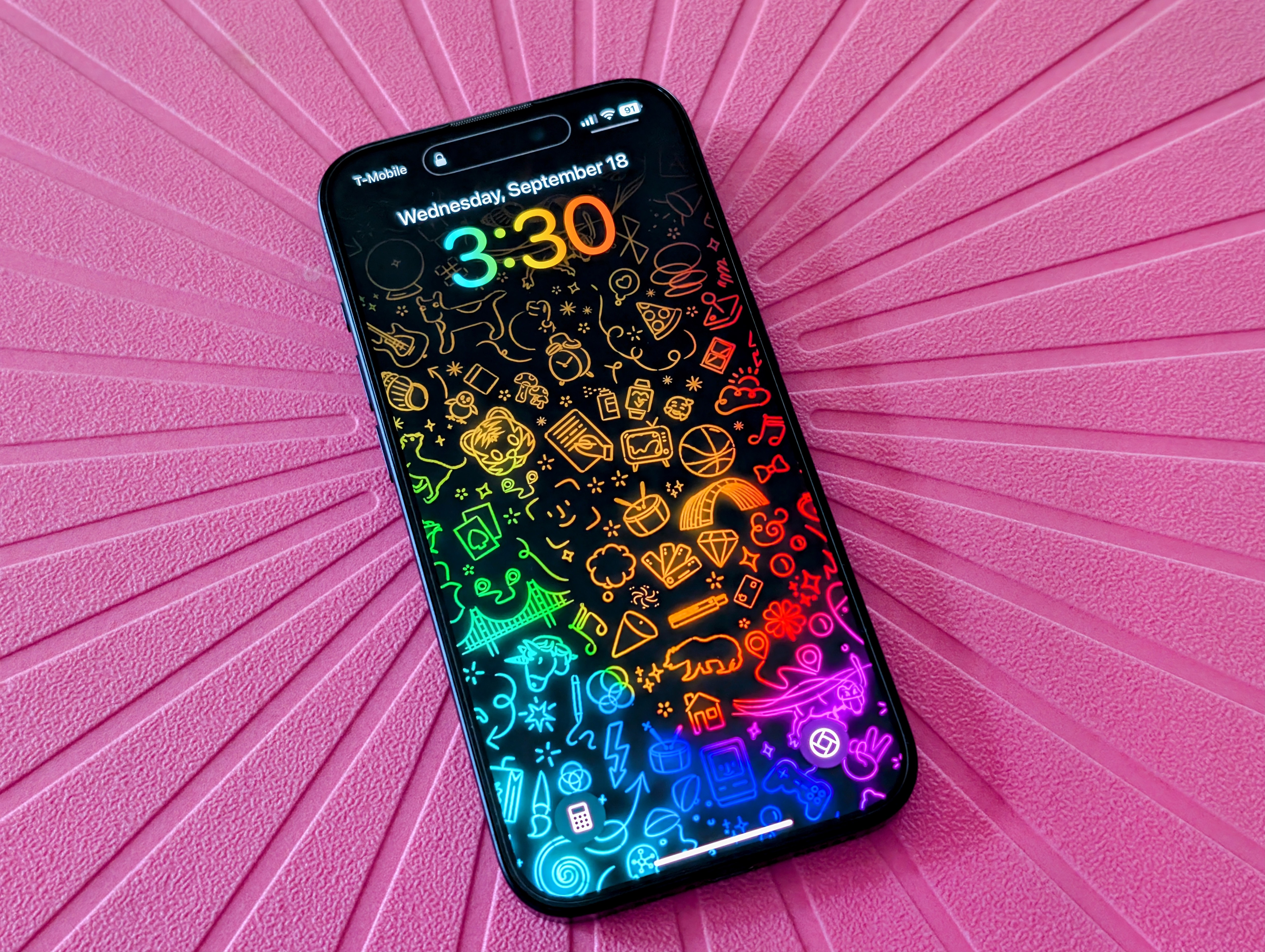 iPhone 15 Pro with iOS 18 lock screen.