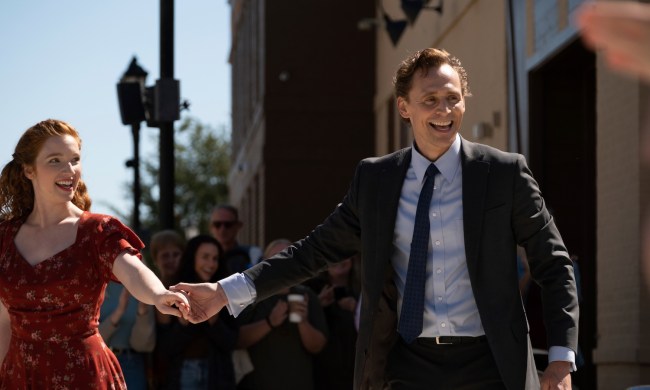 Tom Hiddleston holds Annalise Basso's hand in "The Life of Chuck."